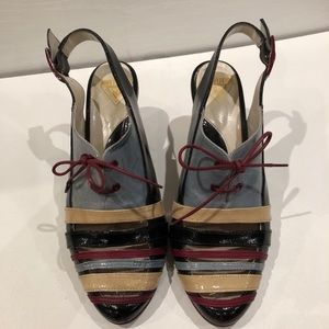 John Fluevog styling patent leather heels